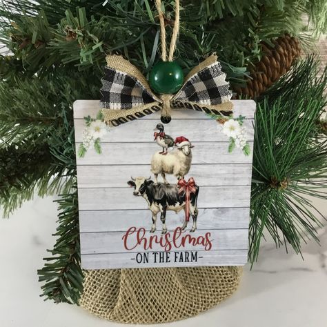 🎄✨ New Arrival Alert! ✨🎄 Introducing this new "Christmas on the Farm" Wooden Ornament! 🦆🐑🐄 This 3.5" square ornament features a duck, sheep, and cow stacked in a playful scene against a rustic barn wood background. Perfect for adding farm fun to your Christmas decor. 🌾🎄 Available now on my website! 🛒 (Link in bio) #RusticDecor #ChristmasOrnament #FarmhouseStyle #HolidayDecor #ChristmasDecor #FarmhouseChristmas #RusticChristmas #CountryChristmas #FarmChristmas #Christmas2024 #ChristmasGift... Christmas On The Farm, Santa's Magic Key, Farm Fun, Farmhouse Crafts, Vintage Thanksgiving, Charming Christmas, A Sheep, Wooden Ornament, A Duck