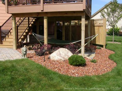 Incorporating the space under the deck can make the maintenance that much easier. The space can be delightful and pleasing to look at as part of the landscape. Outdoor Bonus Room, Under Deck Landscaping, Landscaping Around Deck, Deck Landscaping, Under Deck, Backyard Hammock, Building A Porch, Under Decks, Deck Plans