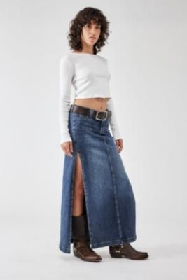 Timeless denim maxi skirt from BDG. Column silhouette cut from a dark-rinse denim Ft. a low-rise waist, button and zip fastening, belt loops and classic five-pocket styling. Finished with two extreme thigh-high slits to either side. Only at UO. **About Better Cotton** \- By choosing our cotton products, you’re supporting our investment in Better Cotton’s mission \- This product is sourced via a system of mass balance and therefore may not contain Better Cotton \- Bettercotton. org/massbalance **Content + Care** \- 99% Cotton, 1% Elastane \- Machine wash **Size + Fit** \- Model is 171cm/5'7.5" and wearing size 27W \- Use our size guide to check how this product fits | BDG Tobi Denim Maxi Skirt - Dark Blue L at Urban Outfitters Tube Top And Skirt, White Bandeau, Denim Maxi, Denim Maxi Skirt, Blue Fits, White Maxi, Maxi Skirts, Silhouette Cut, Bandeau Top