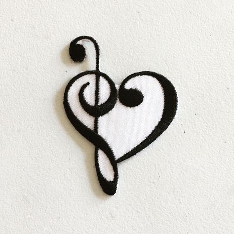 A patch for music lovers, with two intertwined symbols: the treble clef and the heart :) DETAILS * Size: 45mm wide, 64mm tall * Ready to iron on  * To be used on denim, cotton and non-stretch fabrics (can be used on synthetic fabrics as well, but it might cause them to shrink around the edges) * Please follow instructions carefully to ensure correct application: 1. Preheat your iron (high heat is necessary to ensure that the patch will adhere to the fabric). 2. Place the patch with the sticky si Senior Jackets, Intertwined Hearts, Rose Gold Wallpaper, Musical Gift, Diy Bag Designs, Laser Cut Earrings, Cap Decorations, Hand Embroidery Tutorial, Embroidery Tutorial