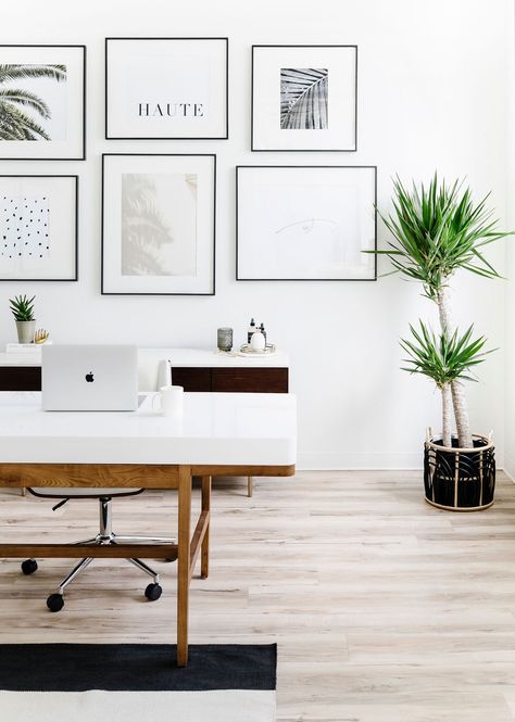 Hella Design Studio | Minimal & Feminine Office | Calgary Interior Design Having a gallery wall behind your desk makes for a cute focal point as you enter the room, and a Zoom background that will have folks talking. We used our clients images for the prints, and used sleek black frames with large photo mats to keep things cohesive and minimal feeling. 📷: @heymjay Office Picture Wall Work Spaces, Video Background Home Office, Home Office Pictures Wall, Office For Zoom Background, Zoom Background Office Space, Cute Office Backgrounds, Home Office Design Background, Best Office Background, Home Office Background Ideas For Zoom