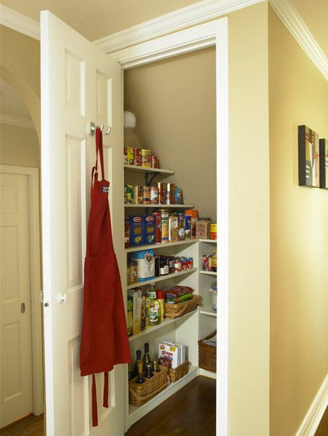 Establish an Efficient Pantry | Convert the space under the staircase into a small room for storing food, paper goods, and extra cooking equipment. Add a door and wrap the three walls with shallow shelves. Under Stairs Pantry, Shoes Organization, Closet Under Stairs, تحت الدرج, Shallow Shelves, Casa Clean, Staircase Storage, Under Stairs Cupboard, Pantry Cupboard