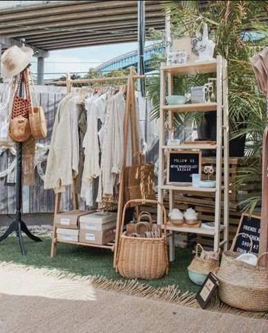 8 Tips to Design a Standout Event Booth for Your Next Craft Fair Baby Boutique Table Display, Pop Up Market Tent Display, Clothing Store Pop Up, Clothing Vendor Booths, Bazaar Booth Ideas Clothes, Portable Booth Display, Pop Up Booth Display Ideas Clothing, Boho Market Booth, Clothing Pop Up Display