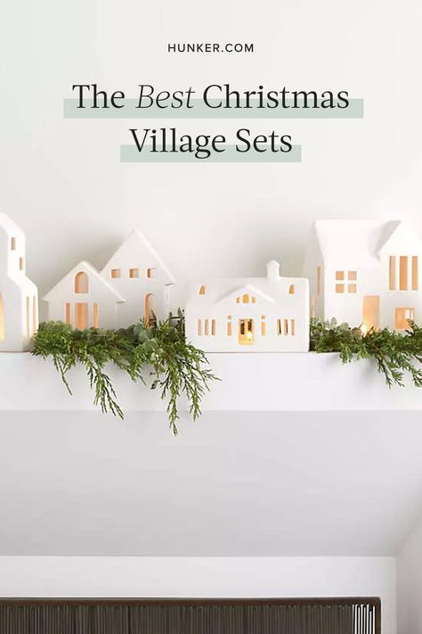 Whether you're looking for village pieces or unique additions to your current collection, here's a list of some of our favorite Christmas village sets. #hunkerhome #christmasvillage #christmasdecor #christmasdecorideas #holidaydecor Diy White Houses Christmas, White House Christmas Village, All White Christmas Village, White House Village Christmas, Christmas White Village Display, Winter Village Decor, Christmas Village Garland, All White Christmas Village Display, White Village Christmas Houses Diy