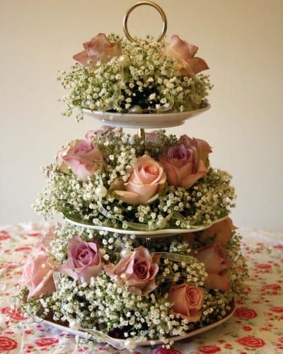 DIY Wedding Centerpieces: 30 Gorgeous Ideas On A Budget | FBFW Cake Stand Centerpiece, Vintage Table Decorations, Vintage Wedding Table, Stand Flower, Flower Centerpiece, Tiered Cake, Centerpieces Wedding, Wedding Floral Centerpieces, Tea Party Bridal Shower