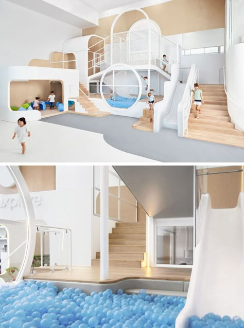 A simple color palette of wood, white, and blue (and a touch of grey) make up this fun space that includes a slide that ends in a ball pit, as well as stairs and small nooks, perfect for kids to play in. Children Library, Black Lifestyle, Kids Cafe, Kindergarten Design, Playroom Design, Bedroom Décor, Play Centre, Indoor Playground, Kids Interior