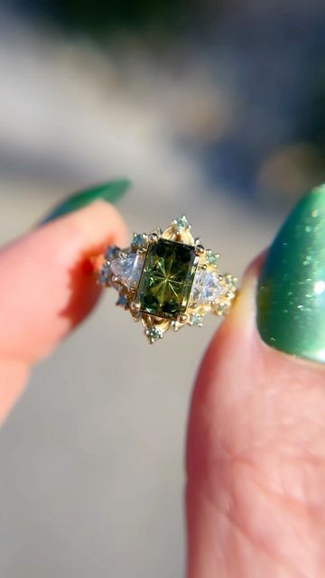 Uma | Engagement Rings on Instagram: "I realize I never share my larger briar setting, but this is a beautiful green Starbrite sapphire with lab diamond sides and mint diamond accents. The larger briar has an overall bigger appearance with larger sides/accents and slightly bigger 🍃 to even out the ratio of the larger stones.🖤" Green Diamond Ring, Green Engagement Rings, Green Diamond Rings, Paper Rings, Pretty Engagement Rings, Future Engagement Rings, Emerald Gem, Paper Ring, Vogue Dress