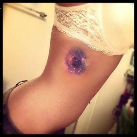 galaxy tattoo ribcage Nebula Tattoo Galaxies, Astronomy Tattoos, Tattoo Ribcage, Watercolor Galaxy Tattoo, Nebula Tattoo, Astronomy Tattoo, Colour Tattoo, Belly Tattoo, Galaxy Tattoo