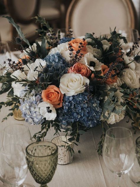 Low centerpieces were composed of blue hydrangeas, peach and white roses, anemones, and thistles. Anemone Centerpiece, Wedding Bouquets Blue, Blue Flower Centerpieces, Blue Fall Wedding, Blue Thistle, Inside Weddings, Low Centerpieces, Hydrangeas Wedding, Wedding Inside