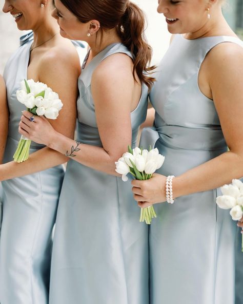 A blue and white wedding at Omni Barton Creek with dusty blue satin bridesmaids dresses, tulip bouquets, and all white flowers | Julie Wilhite Photography - Austin Wedding Photographer Tulip Bouquets For Bridesmaids, One Stem Bridesmaid Bouquet, Bridal Tulip Bouquet, Wedding Bouquets With Tulips, Blue Tulips Bouquet, Bouquets With Tulips, Tulips For Wedding, Light Blue Wedding Bouquet, Tulips Wedding Flowers