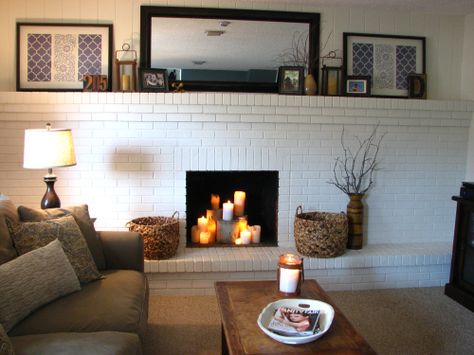 11 Brick Fireplace Makeovers--painting ours white, and the fireplace interior black, would freshen it up. Brick Fireplace Wall, White Brick Fireplace, Painted Brick Fireplace, Painted Brick Fireplaces, Fireplace Update, Brick Fireplace Makeover, Old Fireplace, White Fireplace, Fireplace Remodel