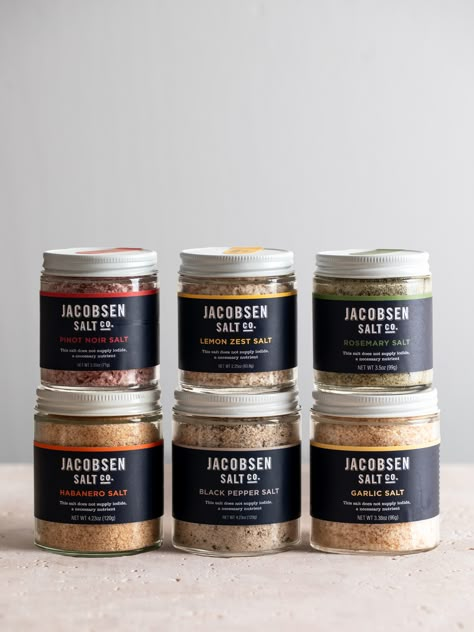 Add a pop of flavor to your pantry with our six best-selling infused salts. This bundle includes the following salts: Black Pepper Salt Garlic Salt Habanero Salt Lemon Zest Salt Pinot Noir Salt Rosemary Salt Spice Mix Packaging, Infused Salts, Salt Blends, Salt Packaging, Infused Salt, Rosemary Salt, Spices Packaging, Gourmet Salt, Systems Design