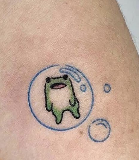 #tattoo #tattoos #frogtattoo #frogs Frog Doodle Tattoo, Cute Frogs Tattoo, Negative Space Jellyfish Tattoo, Tina And Louise Tattoo, Funny Frog Tattoo Ideas, Cute Anime Tattoo Ideas, Small Cute Frog Tattoo, Lil Frog Tattoo, Kawaii Frog Tattoo