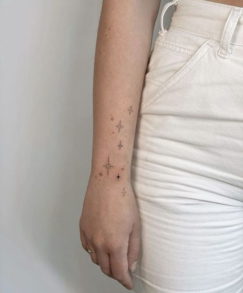 Star Arm Wrap Tattoo, Stars On Forearm Tattoo, Back Of Arm Star Tattoo, Stars Wrap Around Tattoo, Wrist Stars Tattoo, Star Tattoos For Women On Wrist, Arm Tattoos For Women Stars, Constellation Arm Tattoo, Starry Hand Tattoo