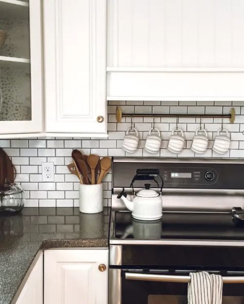 A row of white pumpkin mugs hanging above the stove Top Of Stove Decor, Open Shelf Above Stove, Above The Stove Decor, Above Stove Decor, Mugs Hanging, Pumpkin Mugs, Stove Decor, Simple Fall Decor, Decorating For Fall