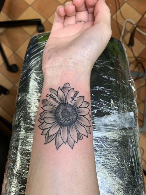 Sunflower With Writing Tattoo, Sunflower Tattoo Name, Sunflower Tattoo With Kids Names, Sunflower Name Tattoo, Sunflower Tattoo With Name, Tattoo Ideas With Names, Tattoo With Names, Tattoos Sunflower, Elf Tattoo