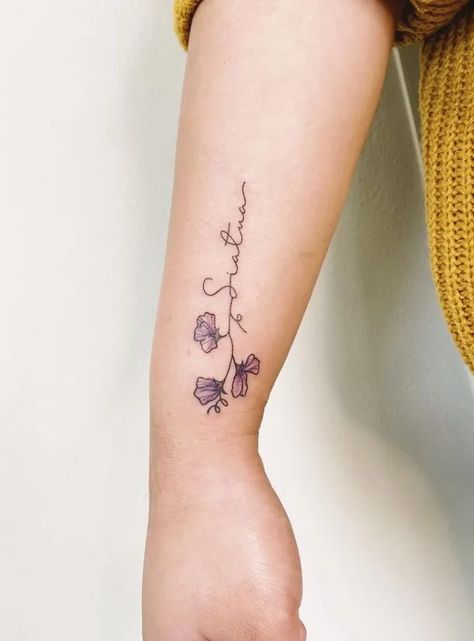 20 Charming Sweet Pea Flower Tattoo For Girls in 2022 16 Sweet Pea Name Tattoo, Sweet Pea Wrap Around Tattoo, Sweetpea Tattoos, Small Sweet Pea Tattoo, Daisy And Sweet Pea Tattoo Birth Flower, Sweet Pea Flowers Tattoo, Sweet Pea Tattoo Design, Daisy And Sweet Pea Tattoo, Sweetpea Tattoo