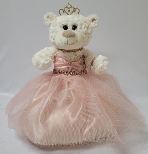 PRICES MAY VARY. 12" Quinceanera Teddy Bear with dress Can be given as a gift or used as a centerpiece 12 inches in height. Rhinestone tiara and an embroidered " Mis 15 Anos" For Collection and Decoration Purpose. For Age 14+. Due to different monitors/calibrations colors may vary slightly from the actual product. For those that are looking for something other than a doll... we now have the option of Quince Bears. These bears measure 12" long. Crème color, soft and cuddly, dressed in an elegant, Quince Must Haves, Quinceanera Last Doll, Quince Bears, Quinceanera Teddy Bear, Dress Centerpiece, Quince Decorations Ideas, Quinceanera Traditions, Quince Crown, Dream Quinceanera