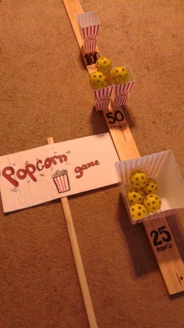 Dollar store popcorn carnival game i made for National Night Out. Popcorn buckets, small waffle balls painted yellow and wood board and marker Scout Carnival Games, Popcorn Games For Kids, National Night Out, National Night Out Ideas, Popcorn Games Activities, Popcorn Prop Diy, National Night Out Activities, Cub Scout Popcorn Kickoff Ideas, Hollywood Themed Games