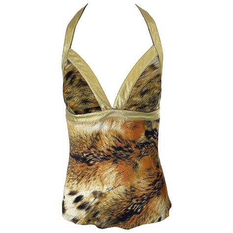 Sexy vintage early 2000s ROBERTO CAVALLI / Just Cavalli lion print and gold lame rayon jersey top ! Features an allover animal print with gold lame straps and racerback. Hidden zipper up the back with hook-and-eye closure. Can easily be dressed up or down. Great with shorts, jeans, a skirt, or trosuers. Would especially look stellar with white denim. In great unworn condition Made in Italy Marked Size Large Measurements: ( has some stretch ) 36 inch bust 32-34 inch waist Tiger Print Outfits, Animal Print Aesthetic, Ramona Badwolf, Vintage Roberto Cavalli, Vintage Blouses, Gold Lame, Lion Print, Racerback Top, Roberto Coin