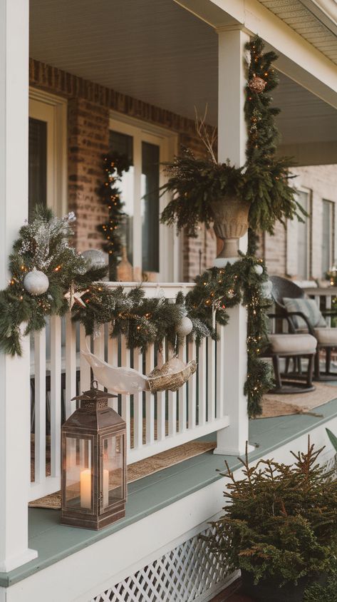 Elevate your home's exterior with these 10 elegant Christmas porch decor ideas that add a touch of sophistication to your holiday setup. With beautifully arranged garlands, classy lanterns, and perfectly placed holiday planters, these ideas will give your porch a timeless, luxurious feel. Christmas Garland Exterior, Small Front Porch Railing Christmas Decor Ideas, Holiday Planters, Veranda Railing, Porch Garland, Front Porch Railings, Fresh Garlands, Christmas Porch Decor Ideas, Holiday Planter