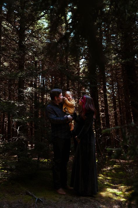 Tattoos, pine trees, black velvet dress, green moss, how could this get any cooler? Moody, dark, family and maternity portaits are now my favorite thing. In Asheville, North Carolina. #moody #dark #forest #photography #portraits #maternity #witchy #skull #skulls #bones #unique #different Dark Family Photos, Gothic Family Photoshoot, Dark Family Photoshoot, Dark Forest Photography, Moody Family Photos, Maternity Family Photoshoot, Velvet Dress Green, Dark Fae, Halloween Shoot