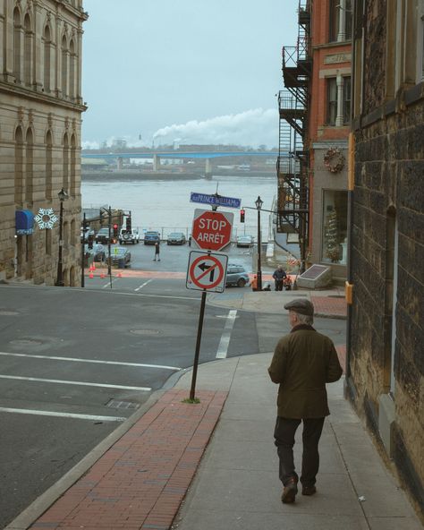 Man walking down a street in Saint John, New Brunswick, Canada Saint John New Brunswick Canada, Saint John New Brunswick, New Brunswick Canada, Rail Transport, Hotel Motel, White Car, Posters Framed, Saint John, City Car