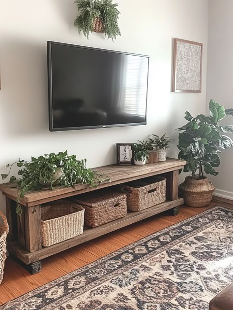 Bohemian Living Room Tv Stand, Wooden Bench Under Tv, Plants On Tv Stand, Entertainment Center Ideas Minimalist, Under Mounted Tv Ideas Living Rooms, Wood Tv Stand Decor Living Room, Small Tv Stand Ideas, Simple Tv Stand Ideas, Boho Tv Stands Living Rooms