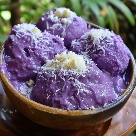 🍠 Indulge in the sweet delight of Ube Halaya! 🍠 #FilipinoDesserts #UbeHalaya Ube Halaya Ingredients: Purple yam (1 lb, boiled and mashed) Coconut milk (2 cups) Condensed milk (1 can) Butter (1/2 cup) Sugar (1 cup) Vanilla extract (1 tsp) Instructions: Combine mashed purple yam, coconut milk, condensed milk, and sugar in a pot. Cook over low heat, stirring constantly. Add butter and vanilla extract. Continue cooking until thick and creamy. Pour into a mold and let cool. Enjoy this vibrant ...