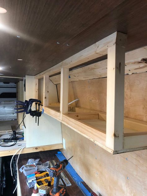 DIY VAN CONVERSION | OVERHEAD STORAGE – CHARLES STEMEN Camper Van Shelving Ideas, Camper Overhead Storage, Diy Van Kitchen, Simple Van Conversion Ideas Layout, Van Cabinets Diy, Van Shelving Ideas, Van Kitchen Ideas, Van Life Storage, Campervan Storage Ideas