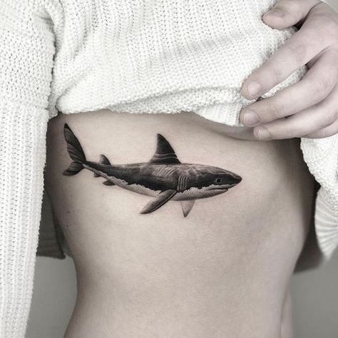 Get ready to dive into the world of shark tattoos and discover their unique symbolism and style. We invite you to learn more about their meaning, as well as choose a design that's right for you. Shark Tattoo, Black And White, Tattoos, White, Black