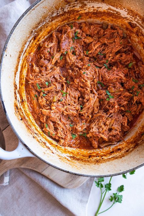 This budget friendly BBQ dutch oven pulled pork is delicious, tender and easy to make. Ideal for batch cooking, to freeze portions, and to have leftovers for the entire week. Gluten-free Pork Shoulder Recipes Dutch Oven, Pulled Pork Dutch Oven, Dutch Oven Pork Shoulder, Camping Pulled Pork, Bbq Pulled Pork Dutch Oven, Dutch Oven Pulled Pork, Pulled Pork Oven Recipe, Pulled Pork Shoulder, Pulled Pork Oven