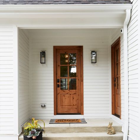 When it comes to decorating your home, the entryway is the first impression your visitors will get. Creating an inviting and cozy atmosphere can be a difficult task, and often times we are at a loss of where to start. If you live in the city of Chicago and are looking to update your entryway with a classic farmhouse style, you're in luck! In this article, we have compiled 15 farmhouse entryway design ideas from local professionals that will help transform your space! Front Porch Lighting, Exterior Light Fixtures, Farmhouse Entryway, House Decor Modern, Porch Wall, Entry Way Design, Entrance Design, Inviting Home, Wall Ceiling Lights