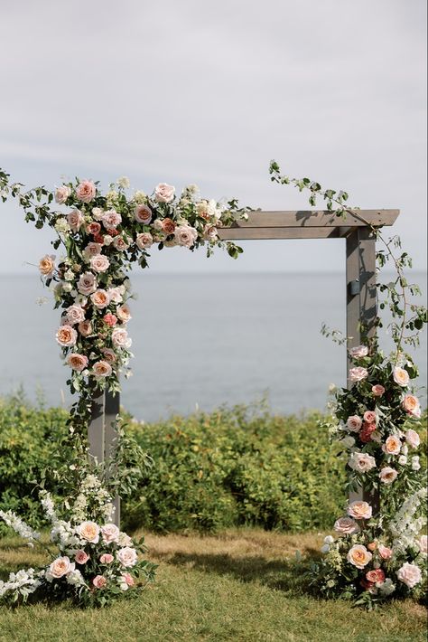 Searching for that luxury garden inspired wedding look? That’s my favorite! Check out this ceremony backdrop in front of the beautiful Nantucket Sound. I’m Courtney! A luxury wedding florist serving Boston, Cape Cod, & Newport, Rhode Island. I have a never ending passion for florals, & I can’t wait to bring your dream vision to life! Ceremony Pergola Flowers, Rectangle Arbor Wedding Flowers, Garden Wedding Arch Outdoor Ceremony, Wedding Ceremony Pergola, Wedding Arbor Florals, Outdoor Chuppah, Wedding Florals Ceremony, Arbor Flowers Wedding, Wedding Gazebo Flowers