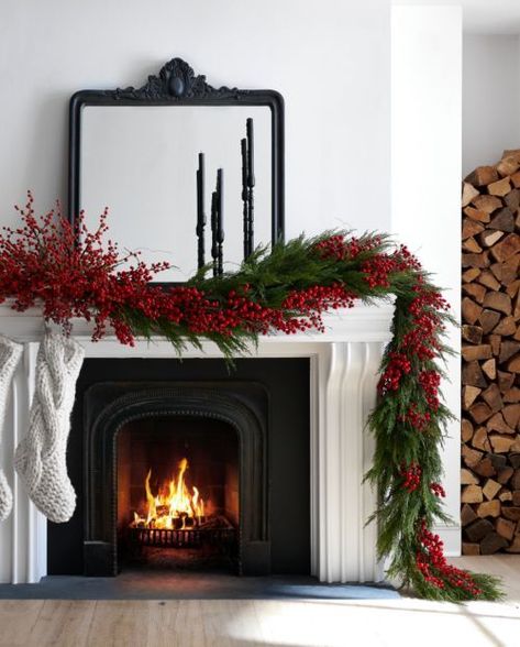 a chic Christmas fireplace with a mantel decorated with evergreens and red berries, with white stockings is a lovely idea Crate And Barrel Mantel Decor, Card Ornaments, Red Christmas Decor, Mantel Ideas, Christmas Mantle Decor, Christmas Mantel Decorations, Christmas Decor Inspiration, Christmas Interiors, Christmas Mantel