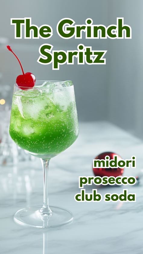 The Grinch Spritz Grinch Champagne Drink, Xmas Cocktails Holiday Drinks, Batch Christmas Cocktail, Christmas Themed Drinks Cocktails, Grinch Cocktail Recipe, Grinch Cocktails, Club Soda Cocktails, Grinch Cocktail, Midori Drinks