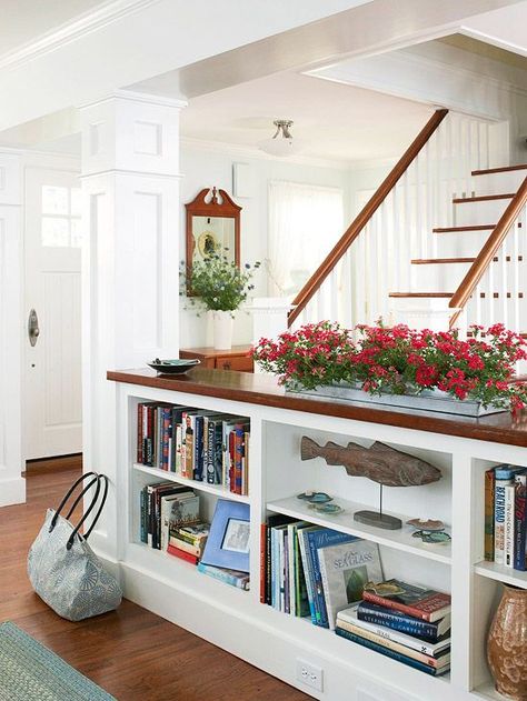 I love the idea of a short bookshelf to divide a room without closing it in. Plus, it gives you some display space on top! Great use of space! Half Wall Storage, Pony Wall Ideas, Half Wall Room Divider, Wall Storage Ideas, Half Wall Ideas, Pony Wall, Half Walls, Low Bookcase, Stair Case