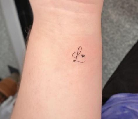 L Initial Tattoo With Heart, Initial L Tattoo Ideas, Letter V Tattoo Ideas Heart, L With A Heart Tattoo, L With Heart Tattoo, Hand Tattoos Initials, Small Husband Tattoo, Cursive L Tattoo With Heart, Small Heart Memorial Tattoo