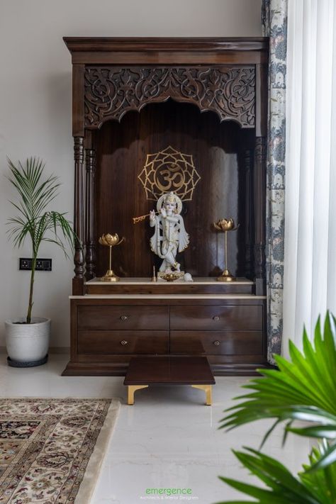 Warmth & Luxury curate this Contemporary Living Space in Indore | Emergence Architects - The Architects Diary Temple In Dining Room, Mandir Space In Home, Interior Design For Mandir, Interior Pillars, Mandir Ideas, Krishna Mandir, Wooden Temple For Home, Wooden Temple, Mandir Design