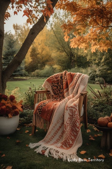 Create a warm and inviting autumn atmosphere with this cozy, patterned blanket draped over a wooden chair amidst vibrant fall foliage. Perfect for outdoor relaxation, this scene captures the essence of the fall season, blending warm hues of orange and brown. Ideal inspiration for adding seasonal touches to your garden or patio decor. #FallDecor #CozyOutdoor #AutumnInspiration #SeasonalBlanket #FallVibes #OutdoorDecor #WarmBlanket #AutumnAmbience #FallStyle Blanket Photoshoot Ideas, Blanket Photoshoot, Patterned Blanket, Curated Ears, Fall Blanket, Chic Lifestyle, Cozy Boho, Outdoor Chair, Textures And Patterns