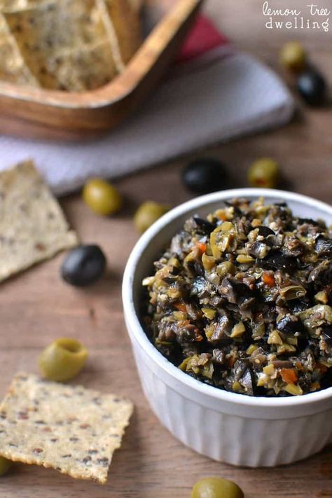 Olive Tapenade made with black and green olives is packed with flavor and perfect for dipping! This easy recipe comes together in minutes and is the BEST olive tapenade ever!  Well.....I am officially done with Christmas treats for the year. We had a good run, if I do say so myself....but all good things must come to an end. I've been packing them up and shipping them off to Jorden's co-workers, family, friends, and teachers. (We can't have all that sugary goodness sitting around ... Olive Salsa, Olive Tapenade Recipe, Lemon Tree Dwelling, Tapenade Recipe, Olive Recipes, Olive Tapenade, Green Olives, Tapenade, Lemon Tree