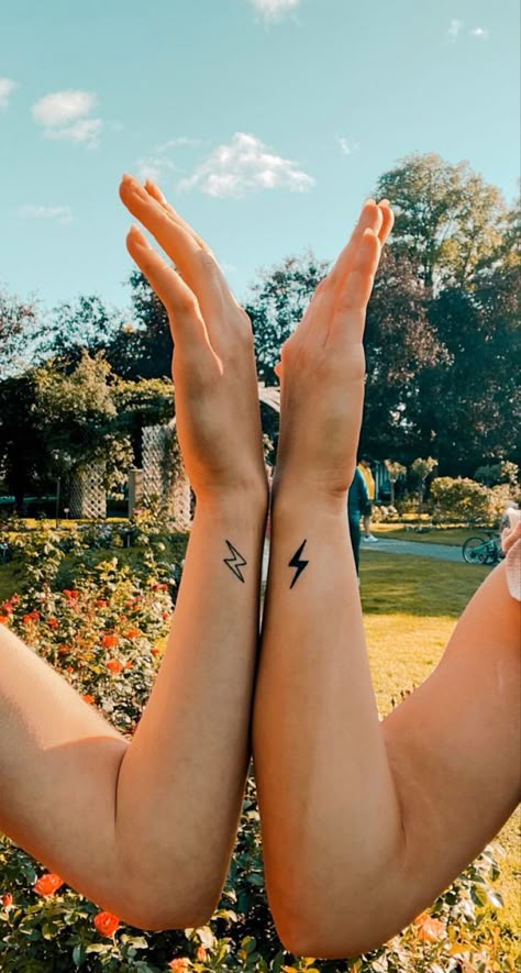 Best friend lightning tattoo idea First Date Tattoo Ideas, Best Friend Lyric Tattoos, Firecracker Tattoo Ideas, Lighting Bolt Tattoo Women, Simple Tattoos For Friends, Twisted Sisters Tattoo, Lightning Heart Tattoo, Lightning Bolt Hand Tattoo, Best Friend Simple Tattoos