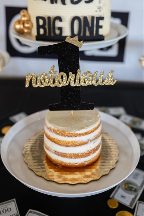 Biggie Smalls themed first birthday — Smash cake from Publix, Cake topper from Etsy #birthday #1stbirthday #biggie #diybirthdaydecor #notoriousone #smashcake #bigone Notorious Big One Smash Cake, Biggie Smalls First Birthday Party Cake, Notorious One Smash Cake, Notorious One Cake, Publix Cake, One Birthday Theme, Notorious One, 1st Birthday Smash Cake, Brunch Board