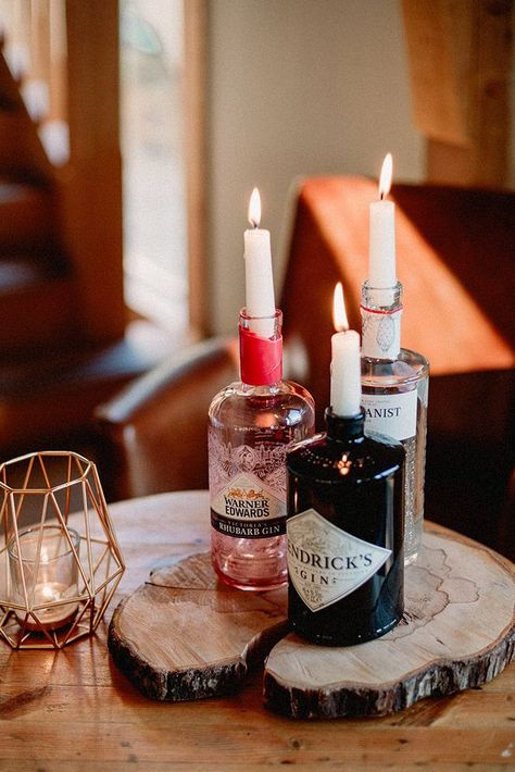 rustic wedding centerpieces glass wisky bottles with candles love luella photography Gin Bottle Candle, Gin Bottle Table Decorations, Gin Bottle Decoration, Gin Bottle Crafts, Gin Decorations, Gin Candle, Candle In Bottle, Candle In A Bottle, Gin Table