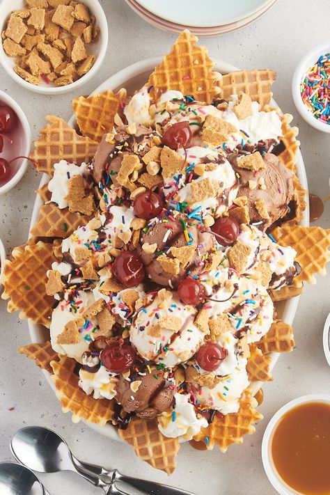 These super easy Ice Cream Nachos are a unique and irresistible dessert with waffle cone chips, creamy ice cream, and a burst of fun toppings! Perfect for parties or a family-friendly dessert. Big Ice Cream Sundae, How To Make Waffle Cone Chips, Crazy Ice Cream Sundaes, Ice Cream Nachos Dessert, Ice Cream Nacho Bar, Waffle Cone Nachos, Ice Cream Nachos Recipe, Ice Cream Nachos, Waffle Cone Chips