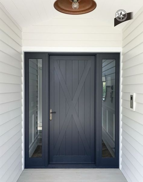 This gorgeous solid timber barnstyle door creates a beautiful entry statement. 

This custom-made door features solid timber “X Bracing” to add character and personality to this entrance.

The entry was designed by M Interiors and built by Distinctive Homes. Cedar West supplied the solid timber entrance set (Surrey door with X Bracing + Hinged Frame with Sidelites). 

Click here to find out more about our Surrey door design: https://cedarwest.com.au/surrey Doors Plus Australia, Modern Farmhouse Entrance Door, Modern Country Front Door, Timeless Front Door, Barn Front Door, Hampton Front Door, Solid Front Door, Country Front Door, Timber Front Door