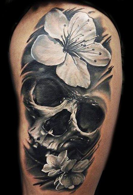 Realistic Skull Tattoo by U Gene | Tattoo No. 12486 Skull Thigh Tattoos, Small Skull Tattoo, Tatoo 3d, Skull Tattoo Flowers, Feminine Skull Tattoos, Skull Rose Tattoos, Catrina Tattoo, Skull And Flowers, Muster Tattoos