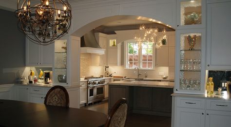 Dining room and kitchen are joined by a cabinetry arch. This archway  not only connects the kitchen and dining room, but provides plenty of storage. Joining Kitchen And Dining Room, Kitchen Archway To Dining Room, Kitchen Diner Archway, Kitchen Open To Dining Room Layout, Room Separation, Dining Room Layout, Real Kitchen, Gathering Room, Dark Kitchen