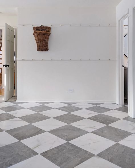 These gray and white marble-look checkered floors are stunning in this bright mud room / laundry room. The stainless steel sink is so classic, and I love all the storage with those shaker pegs too! Grey Marble Checkered Floor, Grey And White Tile Floor Kitchen, Marble Laundry Room Floor, Grey And White Checkered Floor Laundry Room, Gray Checkerboard Floor, Gray And White Diamond Floor, Grey White Marble Floor, Grey And White Checked Floor, Checkerboard Laundry Floor