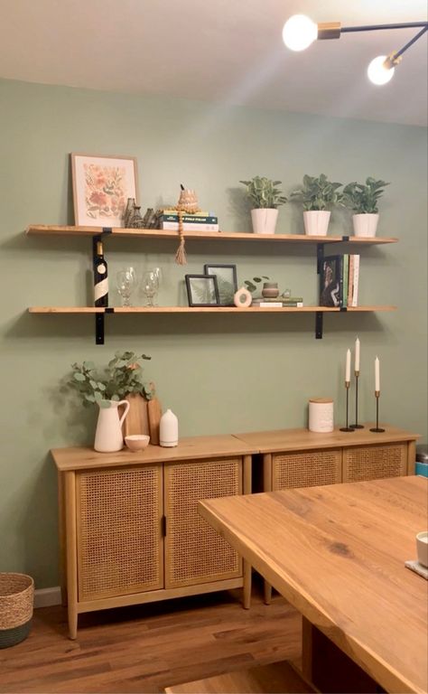 Sage Green Walls Wood And White Buffet Table, Dining Room Decor Sage Green, Green Buffet Dining Room, Sage Green Dining Room Decor, Sage Green Statement Wall, Sage Green Kitchen Wall Shelves, Green Wall Wood Shelves, Sage Green Dining Room, Brick Dining Room